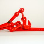 Lever-style load binder used for securing transport chains on trailers and flatbeds, featuring a heavy-duty steel body and lever handle for quick tensioning and load tightening during cargo transport.