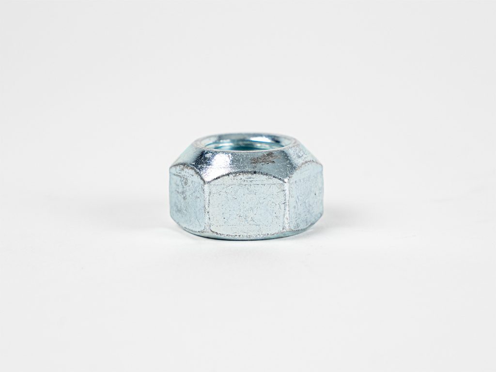 Close-up product image of a zinc-plated trailer wheel nut with a hexagonal design, shown against a white background. The durable wheel nut is designed for secure wheel mounting and reliable trailer performance.