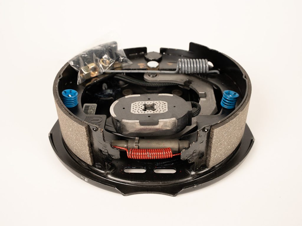 Dexter brake assembly K23-027-00 for trailer axle brake systems, designed to provide reliable stopping power and consistent braking performance for safe towing applications.