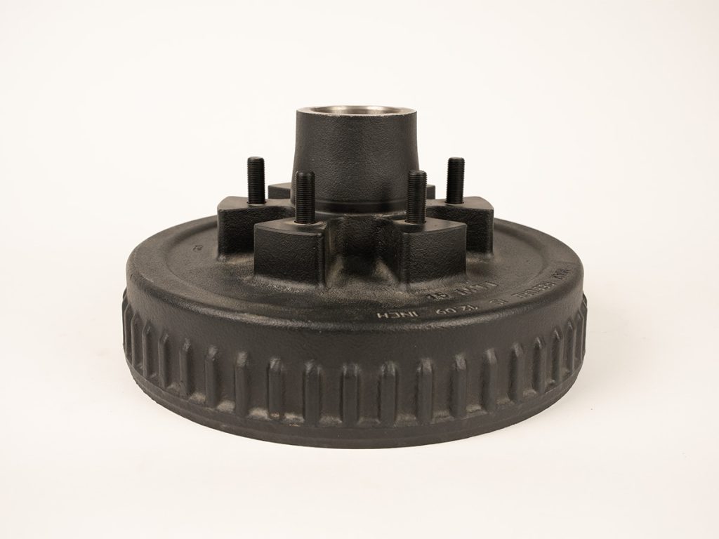 Complete one piece hub and drum kit for 3.5K to 7K axles with 5-lug, 6-lug, or 8-lug bolt patterns and 1/2 inch to 5/8 inch wheel studs on white background