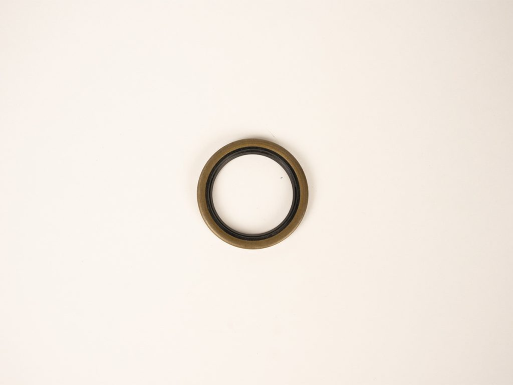 Dexter 010-009-00 trailer grease seal designed for trailer hub and axle assemblies, helping protect wheel bearings from dirt, moisture, and contaminants for reliable performance.