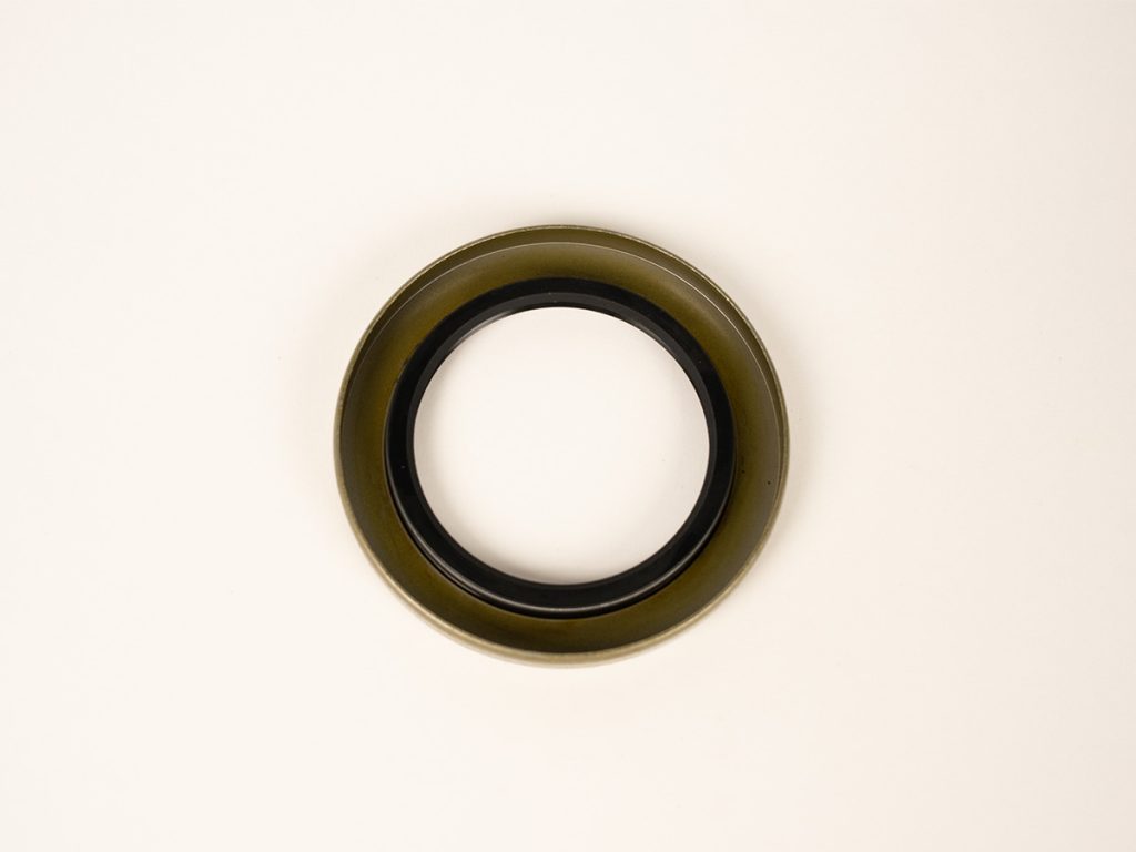 Dexter 010-036-00 trailer grease seal designed for hub and axle assemblies, helping prevent dirt, water, and road debris from entering wheel bearings for improved trailer reliability.