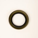 Dexter 010-036-00 trailer grease seal designed for hub and axle assemblies, helping prevent dirt, water, and road debris from entering wheel bearings for improved trailer reliability.