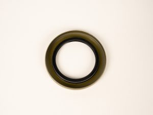 Dexter 010-036-00 trailer grease seal designed for hub and axle assemblies, helping prevent dirt, water, and road debris from entering wheel bearings for improved trailer reliability.