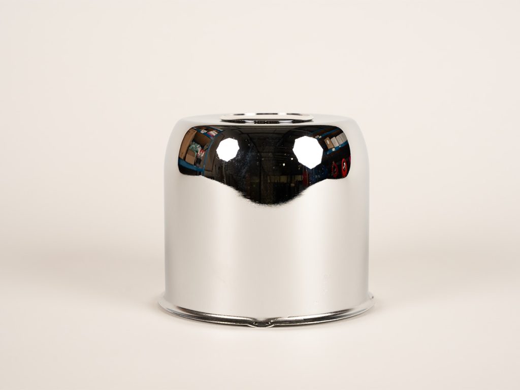 Chrome trailer wheel center cap with smooth dome design for Dexter EZ Lube axles.