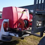 QR 225-gallon high-pressure fire suppression skid unit, mounted on a heavy-duty frame with pump and hose system designed for rapid emergency fire response in agricultural and industrial applications.