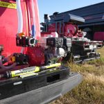 QR 225-gallon high-pressure fire suppression skid unit, mounted on a heavy-duty frame with pump and hose system designed for rapid emergency fire response in agricultural and industrial applications.