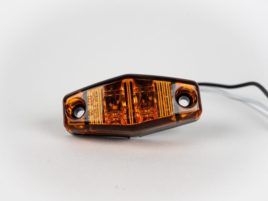 Amber Mini Oblong 2-LED Surface Mount Marker Light with ground wiring.