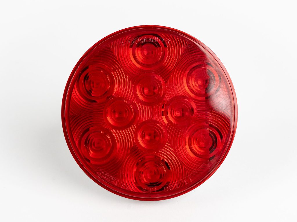 Red 4 inch Round 10-LED Grommet Mount Tail Light, showing 10 light-emitting diodes.