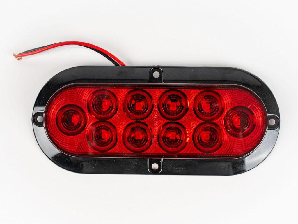 Red Red 6 inch Oval 10-LED Surface Mount Tail Light. Also works as turn and brake light. Showing 3-wire electrical connection.