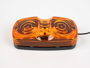 Bullseye Marker Light MC42AB surface mount with yellow (amber) lens. Showing single electrical wire. Also works as clearance light.