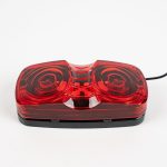 Bullseye Marker Light MC42RB surface mount with red lens. Showing single electrical wire. Also works as clearance light.