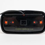 Back of Bullseye Marker Light MC42RB surface mount with red lens. Showing single electrical wire.