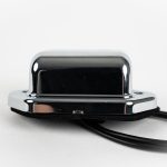 Oblong 2-LED License Plate Light with chrome ABS housing, polycarbonate lens, 2 wires, chrome cover & mount. Top.