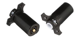Dual view showing front brass contacts and rear cable entry of Pollak 11-700 7-way RV blade trailer plug connector.