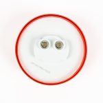 Back of red 2 1/2 inch Round Clearance Light showing pre-greased plug-in for 2-prong electrical wiring.