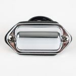 Front-angled view of a surface-mount chrome-hooded license plate light featuring a high-polish finish, two Phillips mounting screws, black foam mounting gasket, and wiring leads against a white background.