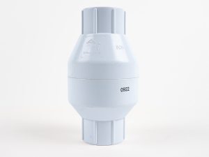 White Schedule 40 PVC 1" check valve showing flow direction arrow markings and ribbed socket ends