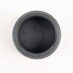 Bottom interior view of a black 3" Banjo polypropylene camlock dust plug showing the cavity.